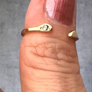 Gold plated ring adjustable size tiny clear stone